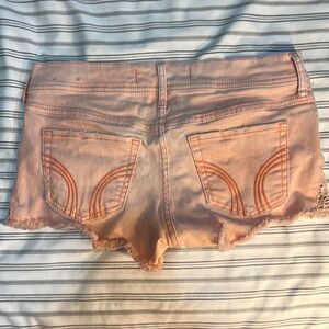 Hollister Short-Shorts Size 3. Waist: 26 inches. Pink with embroidery on hips